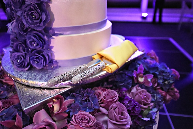 Ornate Cake Server Set
Photography: Carasco Photography
Read More:
http://www.insideweddings.com/weddings/city-wedding-at-chicago-planetarium-with-purple-yellow-palette/688/ White wedding cake with purple sugar roses, crystals, silver handled cake server set in gold napkin