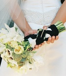 Ivory Bridal Bouquet
Photography: Yvette Roman Photography
Read More:
http://www.insideweddings.com/weddings/sophisticated-black-white-wedding-in-santa-barbara-california/113/ Bride holds white flower bouquet behind her back