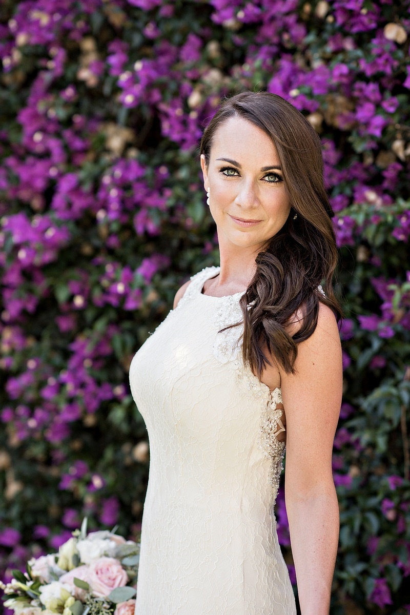 Bride in Lace Sheath Dress Poses with Flowers
Photography: Laurie Bailey Photography
Read More:
http://www.insideweddings.com/weddings/oceanfront-wedding-ceremony-classic-romantic-ballroom-reception/854/ bride lace sheath dress posing flower wall wedding bouquet white