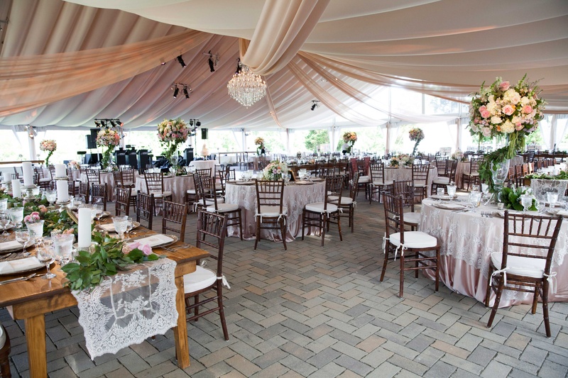 Tented Garden-Inspired Reception Space
Photography: Michael Bambino %26 Co.
Read More:
http://www.insideweddings.com/weddings/whimsical-open-air-secret-garden-wedding-with-soft-spring-hues/777/ a whimsical tented space in an outdoor area with tables that featured a secret garden theme greenery