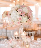 Lush Pink %26 White Arrangement with Candles
Photography: Birds of a Feather
Read More:
http://www.insideweddings.com/weddings/church-ceremony-sparkling-pink-ballroom-reception-with-city-views/1084/ Wedding reception classic decor tall pink and white flower arrangement rose hydrangea gold candles