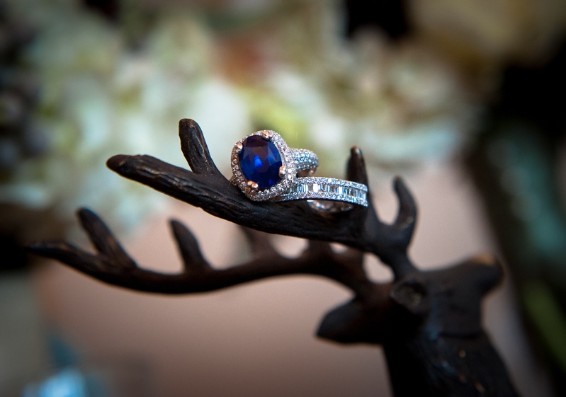 Sapphire Engagement Ring
Photography: Handeland Tesoro Photography
Read More:
http://www.insideweddings.com/weddings/snowy-outdoor-winter-ceremony-cozy-lodge-reception/522/ Blue jewel stone with halo diamonds and eternity band