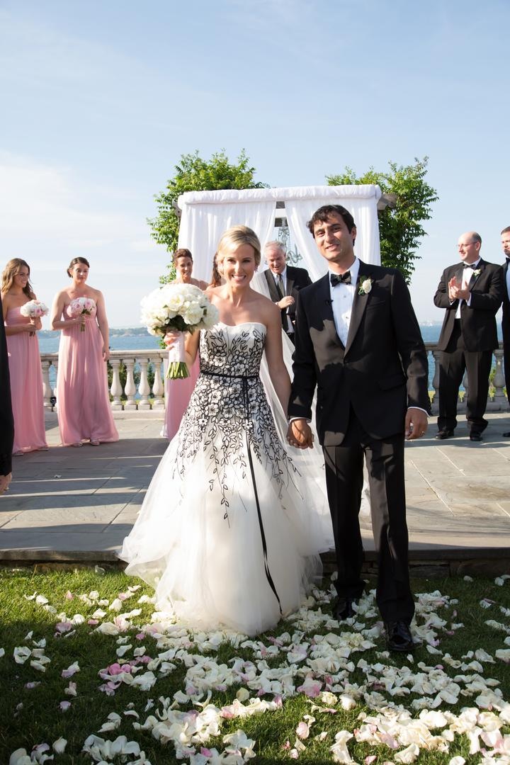 Alfresco Ceremony Newlyweds
Photography: Carrie Rodman Photography
Read More:
http://www.insideweddings.com/weddings/new-england-summer-wedding-by-the-seashore/429/ Bride and groom hold hands at outdoor ceremony altar