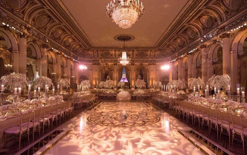 Gorgeous New York City Ballroom Wedding
Photography: The Day by Ira Lippke
Read More:
http://www.insideweddings.com/weddings/opulent-luxury-wedding-with-timeless-color-palette-in-new-york-city/1199/ the plaza hotel wedding ballroom dance floor in center long tables chandeliers light projections