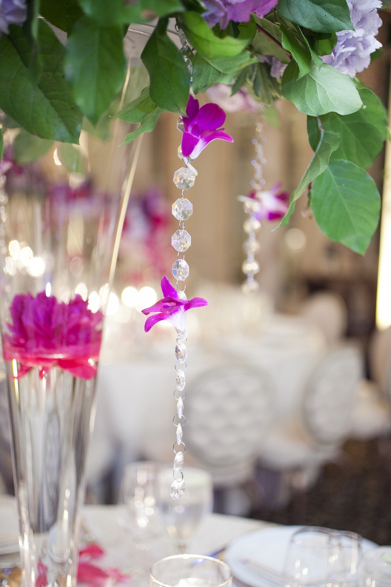 Crystal Garland %26 Fuchsia Orchids
Photography: Images by Berit, Inc.
Read More:
http://www.insideweddings.com/weddings/wedding-with-purple-modern-details-at-a-chateau-in-new-jersey/693/ Wedding reception centerpiece with greenery, floating magenta peony, crystal beads and hot pink orc