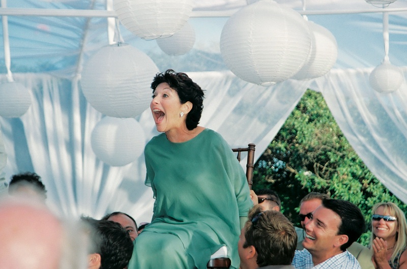 Mother-of-Groom at Reception
Photography: John Solano Photography
Read More:
http://www.insideweddings.com/weddings/tented-beach-wedding-in-malibu-california/24/ Groom's mother partakes in Jewish reception hora dance tradition