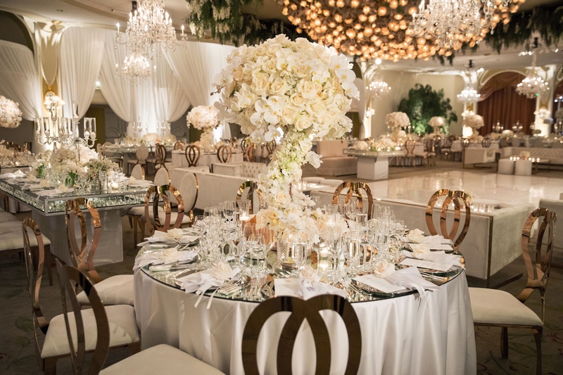 Fairy-Tale Reception Décor
Photography: Duke Photography
Read More:
http://www.insideweddings.com/weddings/luxurious-alfresco-ceremony-ballroom-reception-in-beverly-hills/1161/ wedding reception white rose gold round table mirror top dance floor chandelier beverly hills hotel