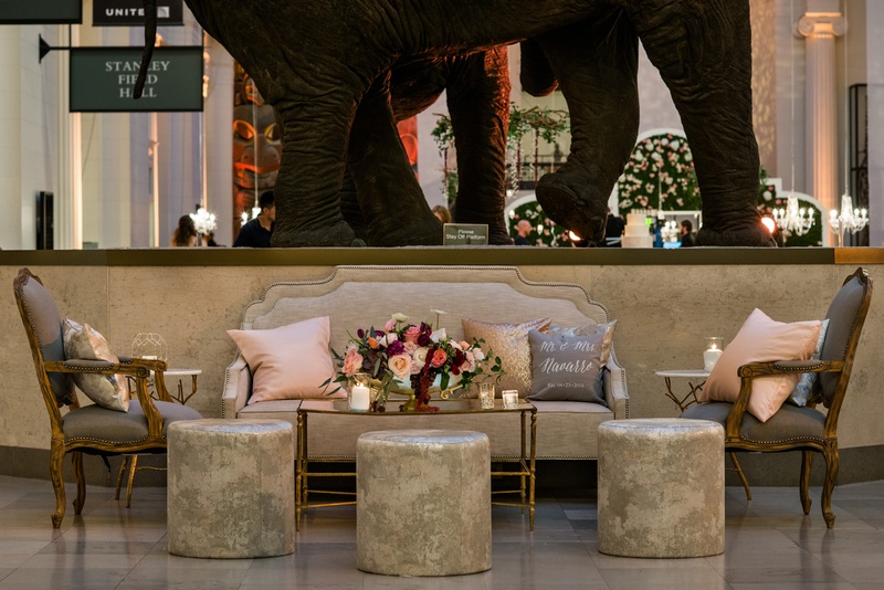 French-Style Lounge Area
Photography: Kent Drake Photography
Read More:
http://www.insideweddings.com/weddings/an-event-planners-wedding-at-a-museum-by-sue-the-tyrannosaurus-rex/955/ Lounge area by elephant sculpture at The Field Museum grey armchair french style settee and ottoman
