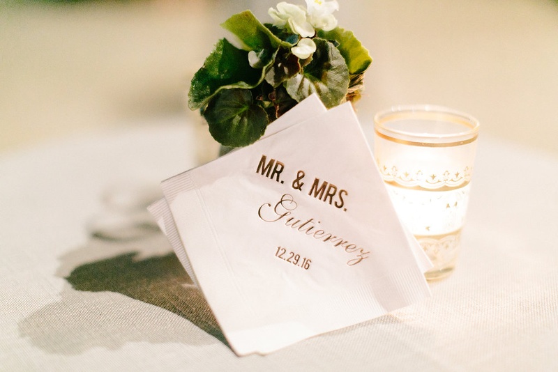 Personalized Cocktail Napkin with Gold Writing
Photography: Jacqui Cole Photography
Read More:
http://www.insideweddings.com/weddings/alfresco-ceremony-dinner-reception-at-an-elegant-villa-in-miami/1020/ White beverage cocktail napkin with gold foil writing mr and mrs gutierrez wedding date