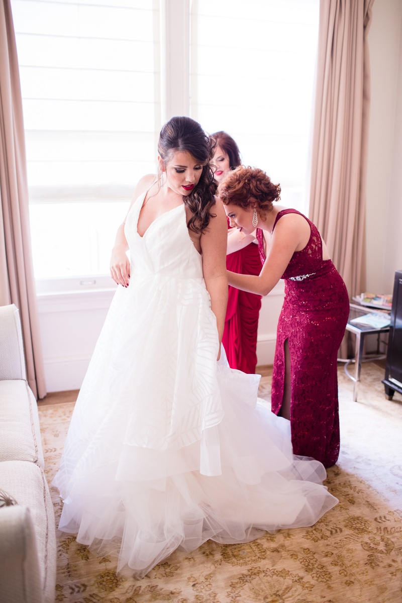 Bridesmaids Help Bride into Gown
Photography: Acqua Photo
Read More:
http://www.insideweddings.com/weddings/balboa-park-wedding-with-wine-inspired-color-scheme-in-san-diego/948/ bridesmaids in wine hued dresses help bride into hayley paige wedding dress