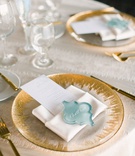 Sea Glass Place Cards
Photography: Aga Jones Photography
Read More:
http://www.insideweddings.com/weddings/jewish-ceremony-on-terrace-modern-bay-view-reception-in-san-diego/1323/ wedding reception place setting with decorative sea glass as place cards on gold detailed charger