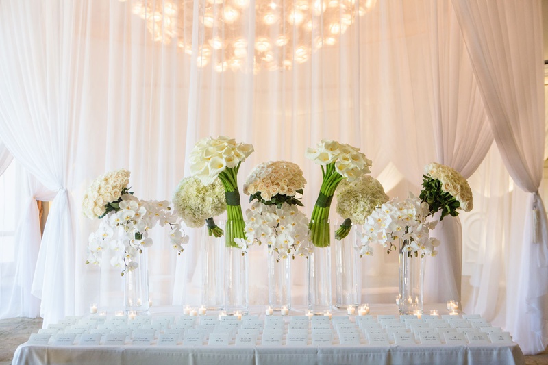 All-White Escort Card Display
Photography: Duke Photography
Read More:
http://www.insideweddings.com/weddings/luxurious-alfresco-ceremony-ballroom-reception-in-beverly-hills/1161/ wedding reception escort card table seating assignments white drapery collections of white flowers