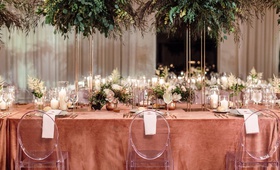 Head Table with Tall Arrangements of Greenery
Photography: Erika Delgado Photography
Read More:
http://www.insideweddings.com/weddings/modern-chic-wedding-with-rustic-touches-and-copper-details/1129/ head table at wedding with ghost chairs and tall arrangements of greenery