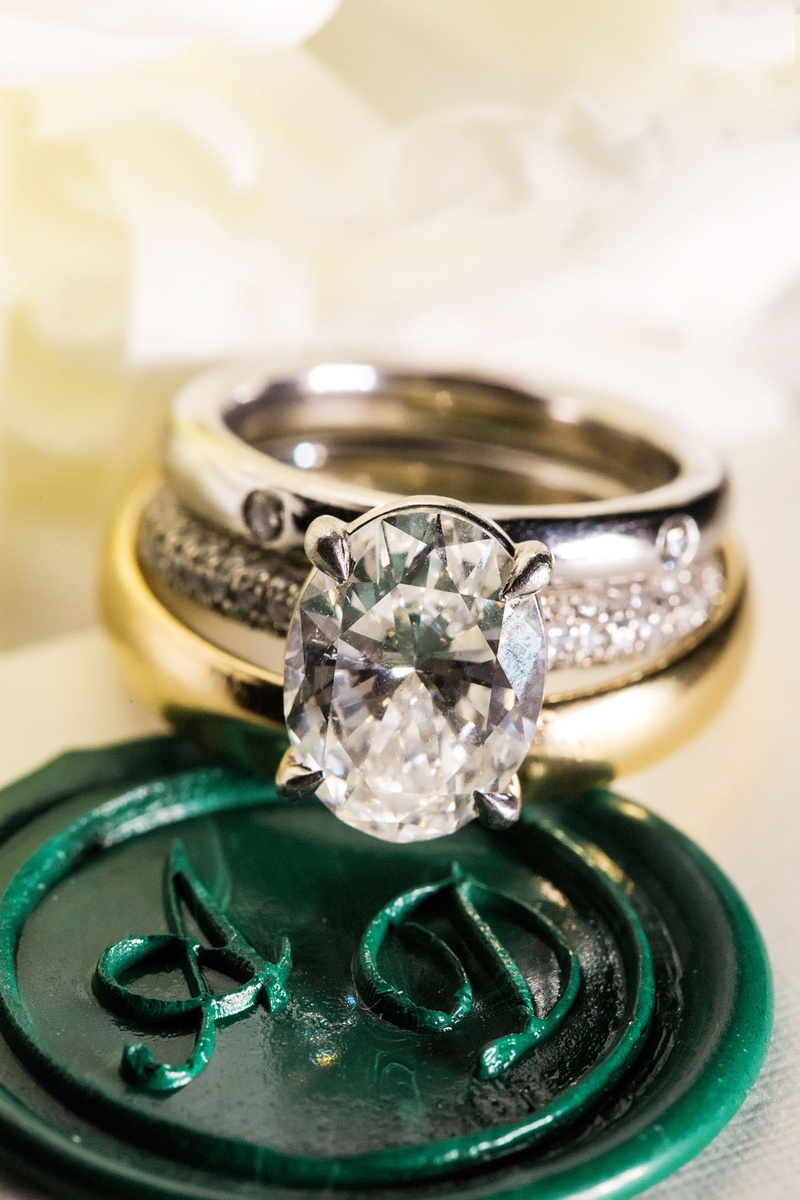 Gorgeous Oval-Cut Engagement Ring
Photography: Vue Photography
Read More:
http://www.insideweddings.com/weddings/summer-destination-wedding-with-rustic-elegant-decor-in-georgia/1032/ Wedding ring on monogram stamp wax seal green with oval solitaire engagement ring four prong