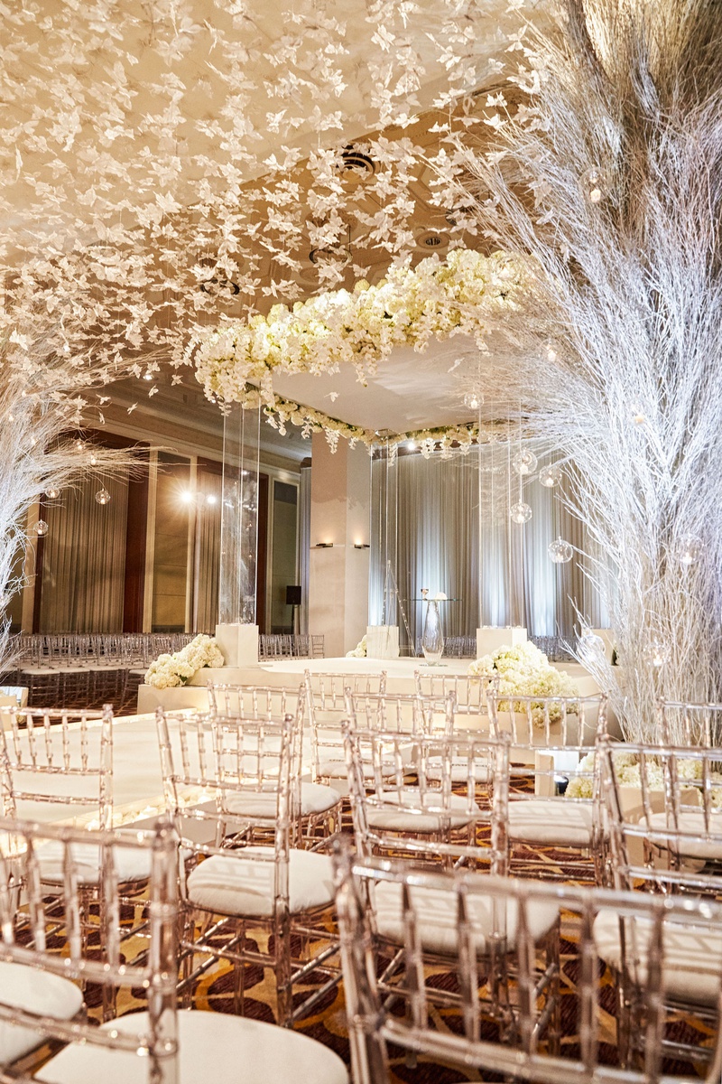 Acrylic %26 White Ceremony Décor
Photography: KingenSmith
Read More:
http://www.insideweddings.com/weddings/luxurious-wedding-featuring-sentimental-butterfly-decor-in-chicago/1348/ ballroom wedding ceremony chicago lucite chair white butterfly hanging from ceiling clear chuppah