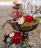 Wine-Colored Florals and Rustic Décor
Photography: Vue Photography
Read More:
http://www.insideweddings.com/weddings/baroque-autumn-wedding-with-deep-wine-tones-in-north-carolina/770/ wine-colored flowers and green moss inside a rustic brown vase with sage and olive greenery candles