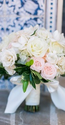 White %26 Pink Rose Bouquet with Leaves
Photography: Troy Grover Photographers
Read More:
http://www.insideweddings.com/weddings/a-romantic-alfresco-destination-wedding-with-a-soft-color-palette/717/ Soft wedding bouquet with white roses, pink roses, and green leaves wrapped with white bow
