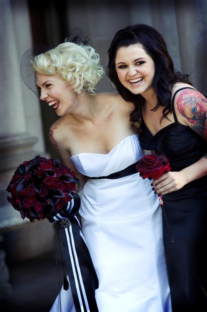 Bride and Bridesmaid
Photography: Barnet Photography
Read More:
http://www.insideweddings.com/weddings/ashley-reeves-and-brandon-saller/261/ Bride in a strapless Alvina Valenta gown and black sash with bridesmaid in a black dress