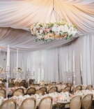 Large Floral Chandelier %26 Drapery
Photography: Kate Osborne Photography
Read More:
http://www.insideweddings.com/weddings/stylish-destination-wedding-with-gorgeous-blooms-in-sundance-utah/1008/ Drapery at wedding reception with large floral chandelier over guest tables long mirror tables
