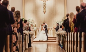 Kiss at Traditional Catholic Ceremony
Photography: Shaun Menary Photography
Read More:
http://www.insideweddings.com/weddings/luxurious-hotel-wedding-texas-fair-themed-after-party-in-dallas/1241/ bride and groom share first kiss at traditional church catholic wedding ceremony dallas texas