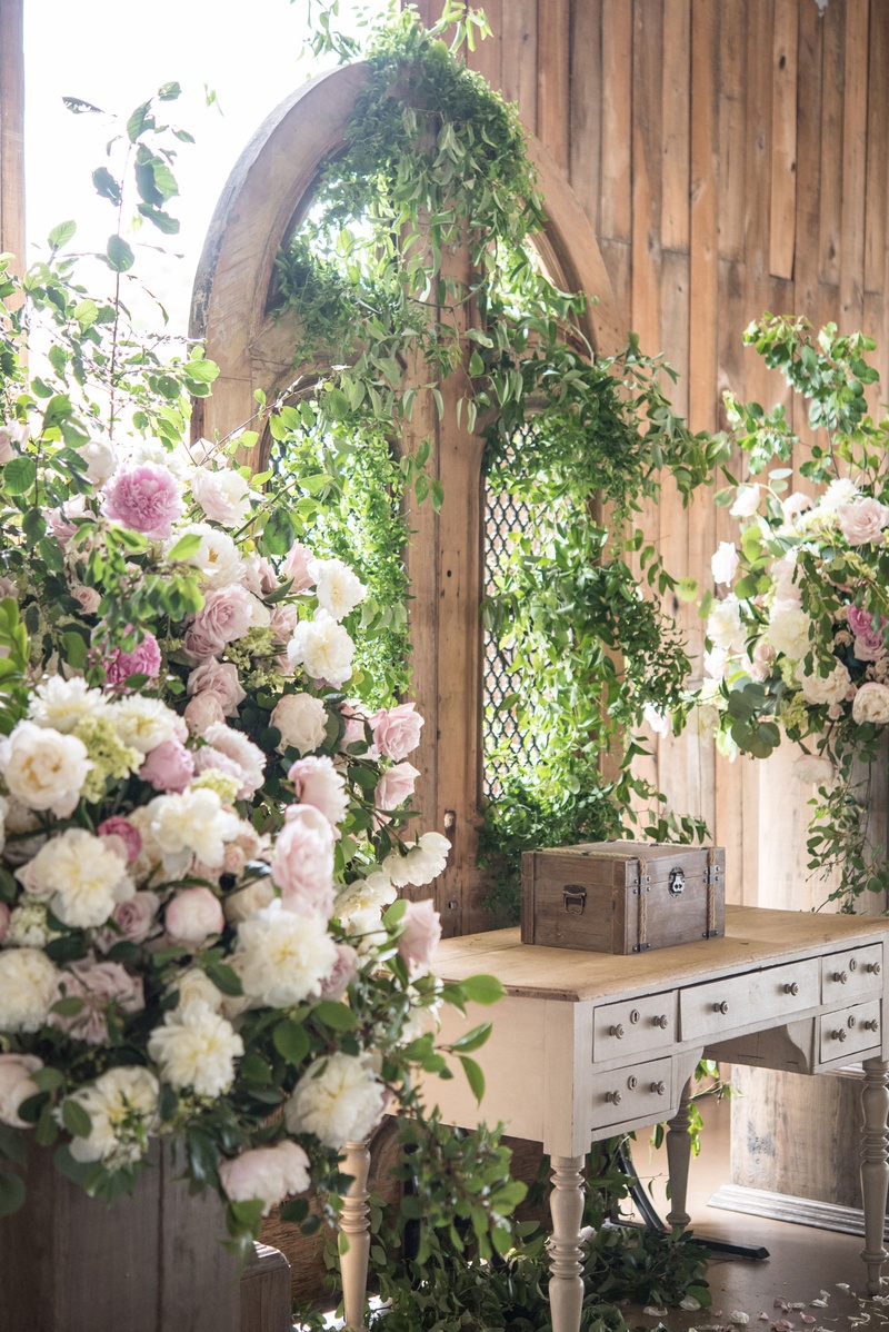 Verdant Gate as Ceremony Backdrop
Photography: Little Tree Studios
Read More:
http://www.insideweddings.com/weddings/brian-winters-of-the-new-york-jets-romantic-rustic-chic-wedding/1245/ barn wedding, greenery on gate as wedding backdrop, table, pink and white floral arrangements
