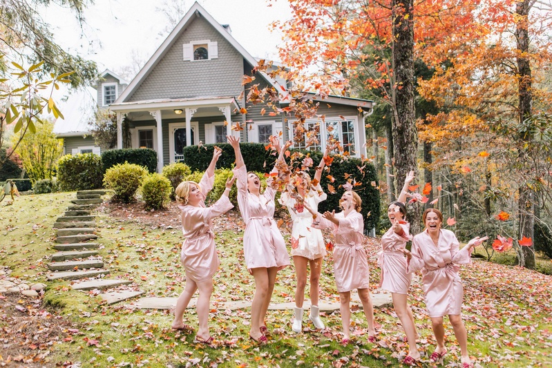 Bride and Bridesmaids in Robes Throw Leaves
Photography: Vue Photography
Read More:
http://www.insideweddings.com/weddings/baroque-autumn-wedding-with-deep-wine-tones-in-north-carolina/770/ bride and bridesmaids dressed in pink and white robes throw fall leaves into their air outside