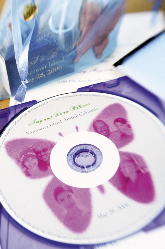 Personalized CD
Photography: Chris + Lynn Photographers
Read More:
http://www.insideweddings.com/weddings/butterfly-inspired-spring-wedding-in-canada/189/ Personalized wedding CD decorated with a pink butterfly and photos of the bride and groom