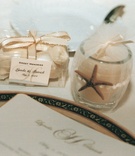 Beach Wedding Favors
Photography: Isabel Lawrence Photographers
Read More:
http://www.insideweddings.com/weddings/romantic-seaside-wedding-at-the-biltmore-in-santa-barbara/76/ Votive candle and chocolates wrapped for guests