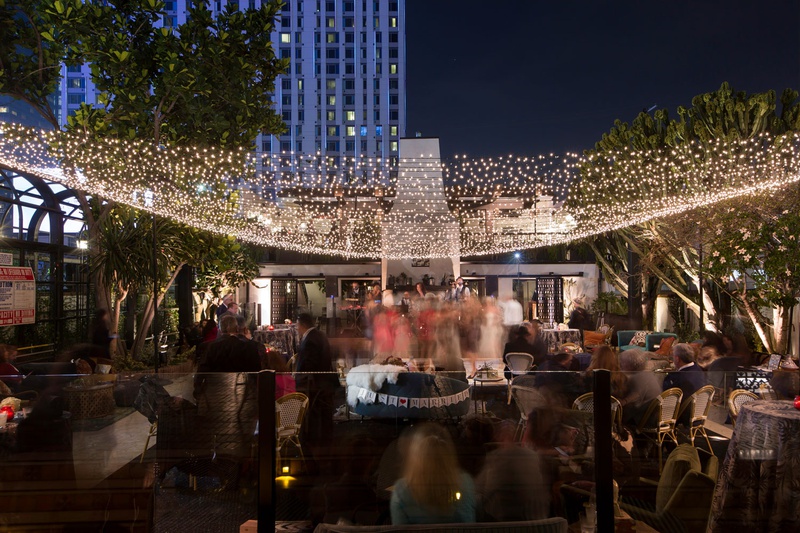 Guests at Casual, Upscale Reception
Photography: Maya Myers Photography
Read More:
http://www.insideweddings.com/weddings/candlelit-jewish-ceremony-unique-cozy-outdoor-reception-in-la/1346/ wedding guests at outdoor reception lounge area just married settee twinkle light canopy downtown la