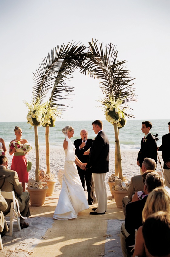 Palm Frond Arch
Photography: Mermin + Christie Photographers
Read More:
http://www.insideweddings.com/weddings/tropical-theme-beach-wedding-in-naples-florida/184/ ceremony arch made of bamboo, flowers, and palm fronds