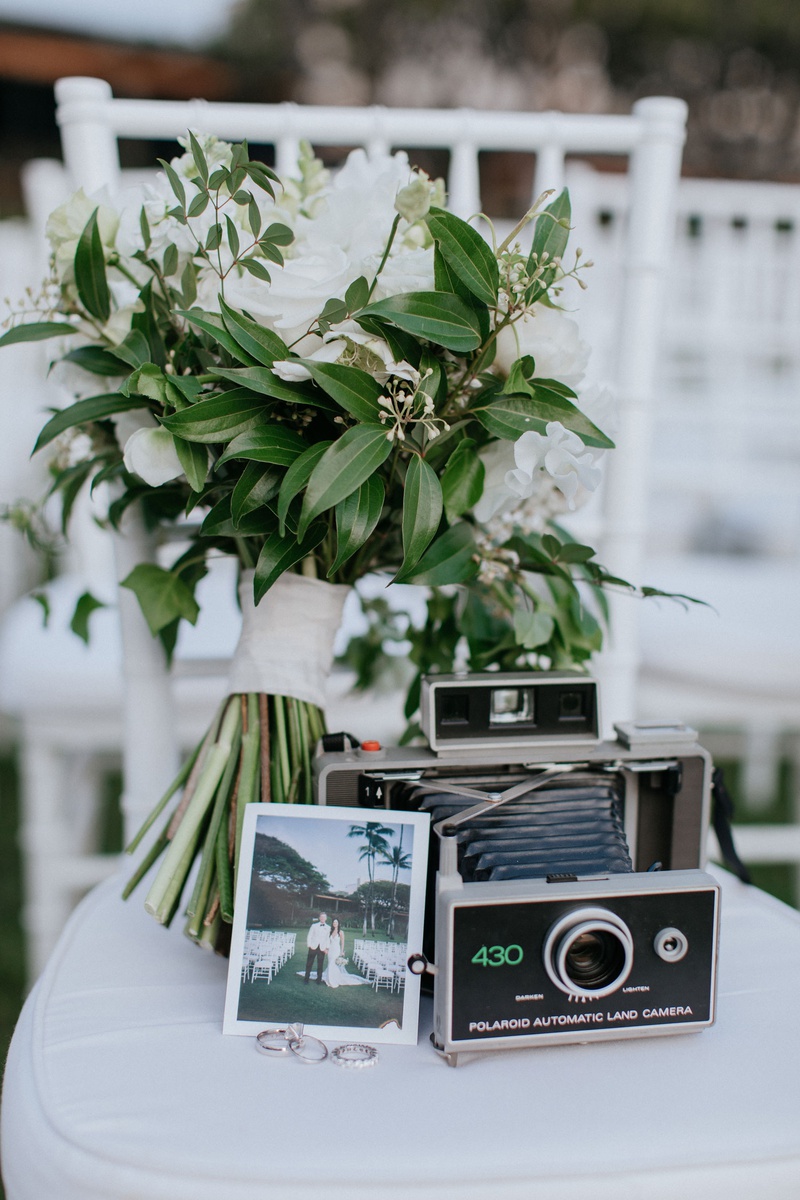 Vintage-Inspired Ceremony Details
Photography: Chris J. Evans Photography
Read More:
http://www.insideweddings.com/weddings/outdoor-winter-ceremony-and-reception-on-the-big-island-in-hawaii/1306/ wedding ceremony white chair bridal bouquet with old polaroid camera vintage antique wedding rings