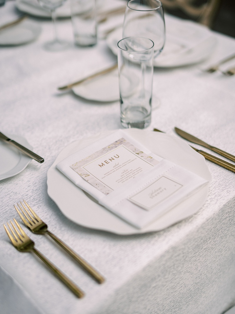 Marble-Inspired Menu Design
Photography: Lauren Gabrielle Photography
Read More:
http://www.insideweddings.com/weddings/summer-real-wedding-featuring-tropical-decor-at-an-art-museum/1328/ wedding reception place setting white charger gold fork knife flatware set gold white marble menu