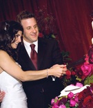 Traditional Cake Cutting
Photography: John Solano Photography
Read More:
http://www.insideweddings.com/weddings/summertime-wedding-with-deep-red-hues-in-ojai-valley-california/240/ Bride and groom cut white flower cake