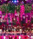 Vibrant Fuchsia Orchid Overhead Arrangement
Photography: Heather Waraksa
Read More:
http://www.insideweddings.com/weddings/summer-wedding-with-vibrant-color-palette-in-brooklyn-new-york/738/ Overhead wedding flower arrangement with cascading orchid, glass sphere, over flower runner