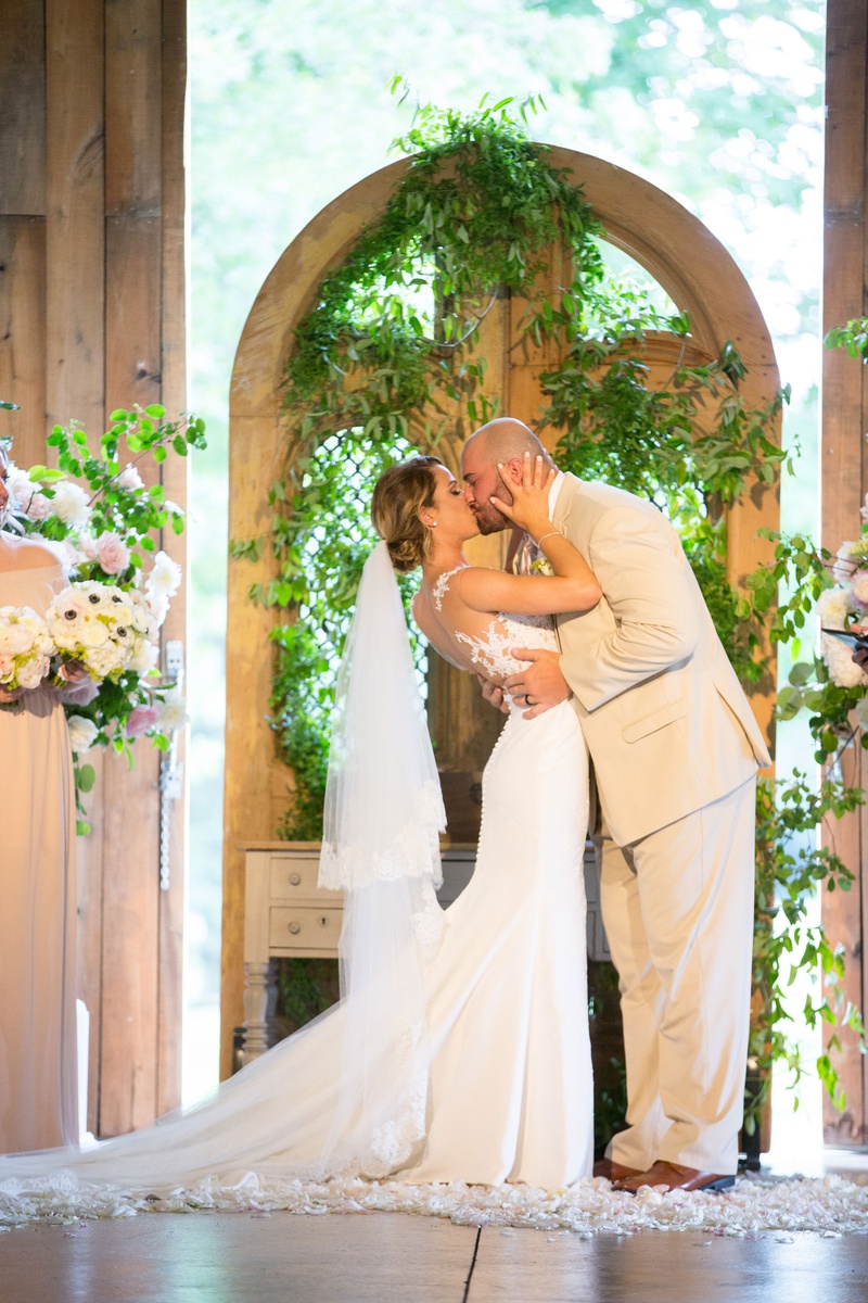 Romantic First Kiss
Photography: Little Tree Studios
Read More:
http://www.insideweddings.com/weddings/brian-winters-of-the-new-york-jets-romantic-rustic-chic-wedding/1245/ new york jets brian winters wedding, groom in tan suit, bride in pronovias wedding dress, kiss