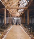 Rustic Wedding Ceremony Under Beams
Photography: Ed %26 Aileen Photography
Read More:
http://www.insideweddings.com/weddings/jewish-wedding-with-rustic-and-elegant-design-elements-in-chicago/975/ Wood beams rustic wedding ceremony venue with flowers and minimal decor birch branches