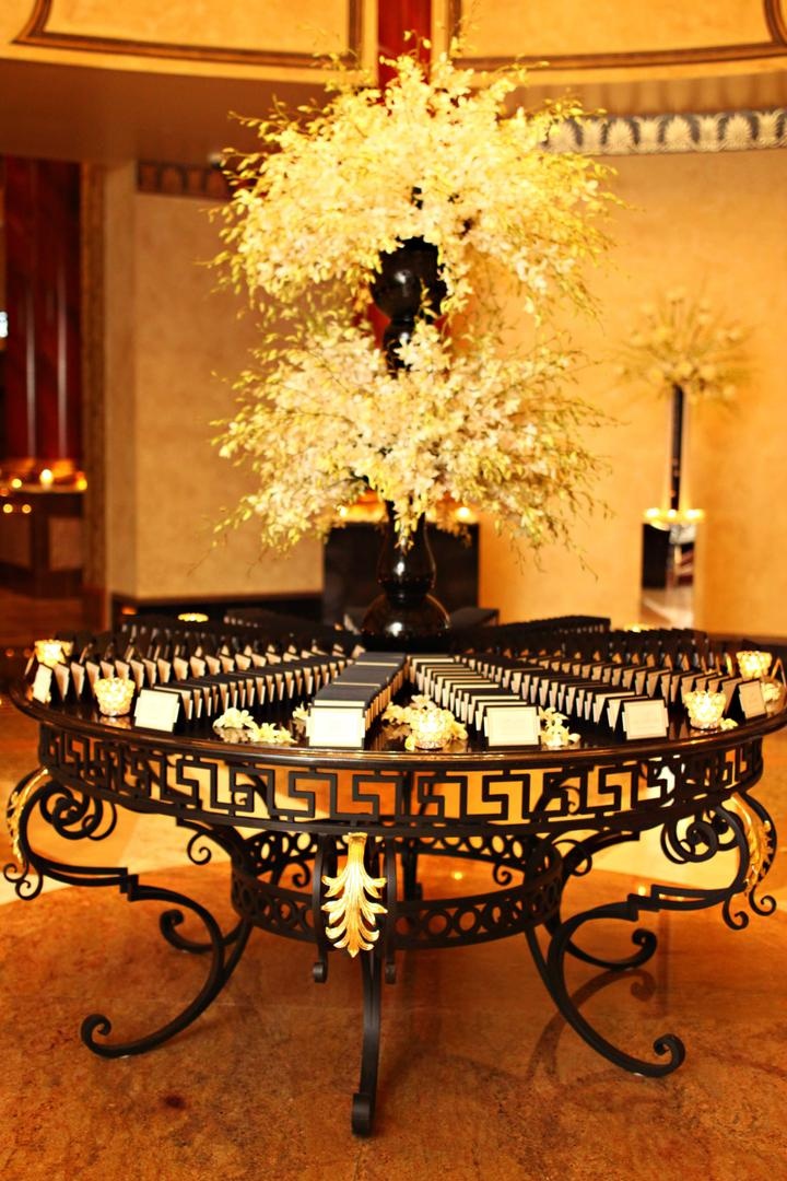 Place Card Table
Photography: Josh Lynn Photography
Read More:
http://www.insideweddings.com/weddings/purple-white-gold-new-jersey-celebration/339/ Wedding place card table with white flowers in black vases and black and white place cards
