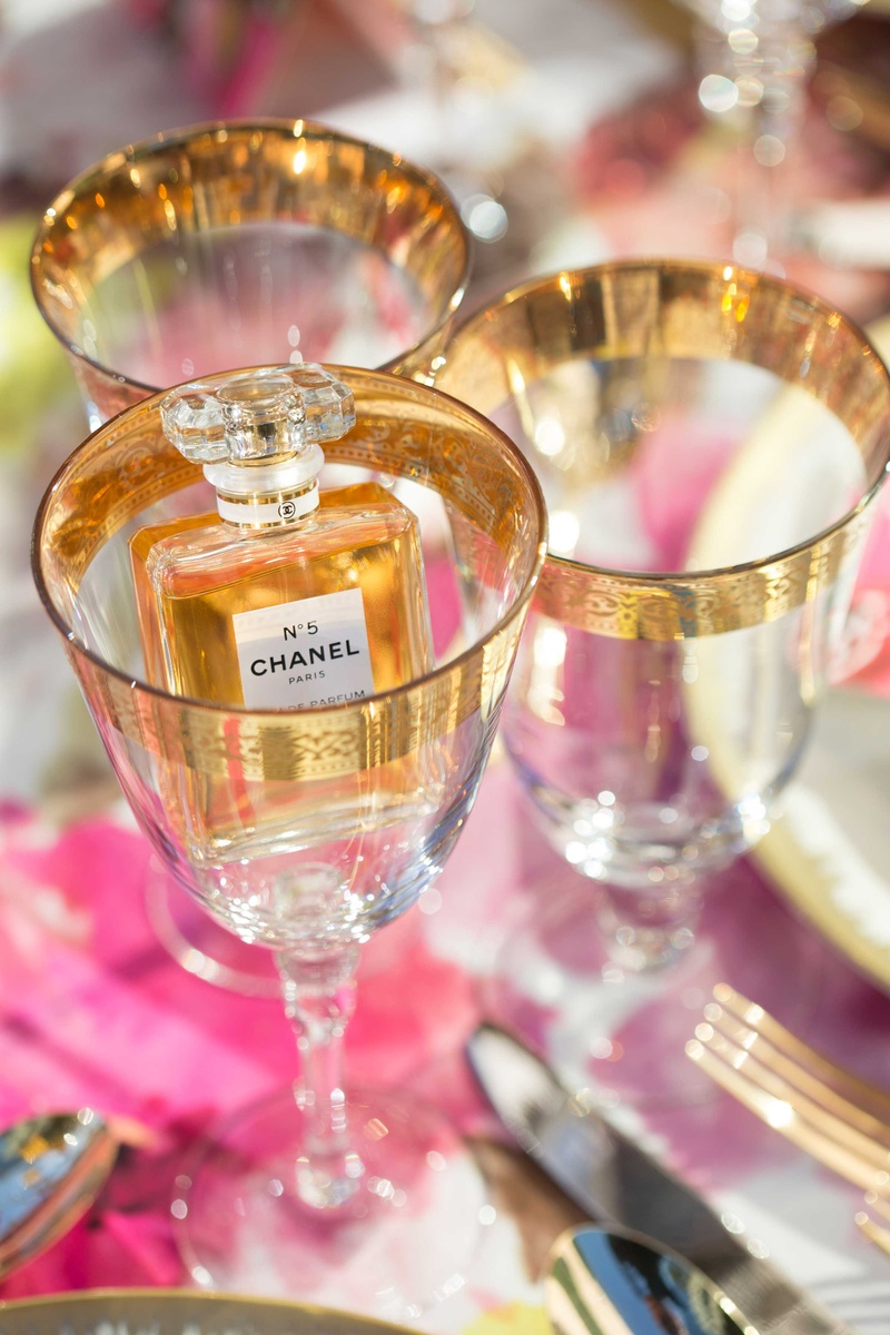Chanel No. 5 Perfume Inside Glass with Gold Detailing
Photography: Thisbe Grace Photography
Read More:
http://www.insideweddings.com/weddings/dramatic-wedding-shoot-inspired-by-alexander-mcqueen-chanel/749/ chanel no 5 five perfume inside wine glass with gold details detailing on table with pink linens