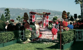 Alice in Wonderland Ceremony
Photography: Lawrence Crandall Photography
Read More:
http://www.insideweddings.com/weddings/alice-in-wonderland-queen-of-hearts-themed-wedding/83/ Queen of Hearts themed wedding ceremony with red and green topiaries