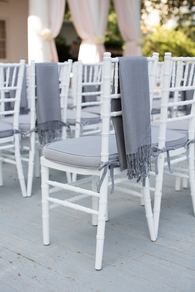 Guest Chairs with Grey Pashminas
Photography: Sarah Kate, Photographer
Read More:
http://www.insideweddings.com/weddings/outdoor-fall-ceremony-opulent-tented-reception-in-dallas-texas/1022/ Guest chair with grey cushion and throw blanket for chilly weather outdoor wedding