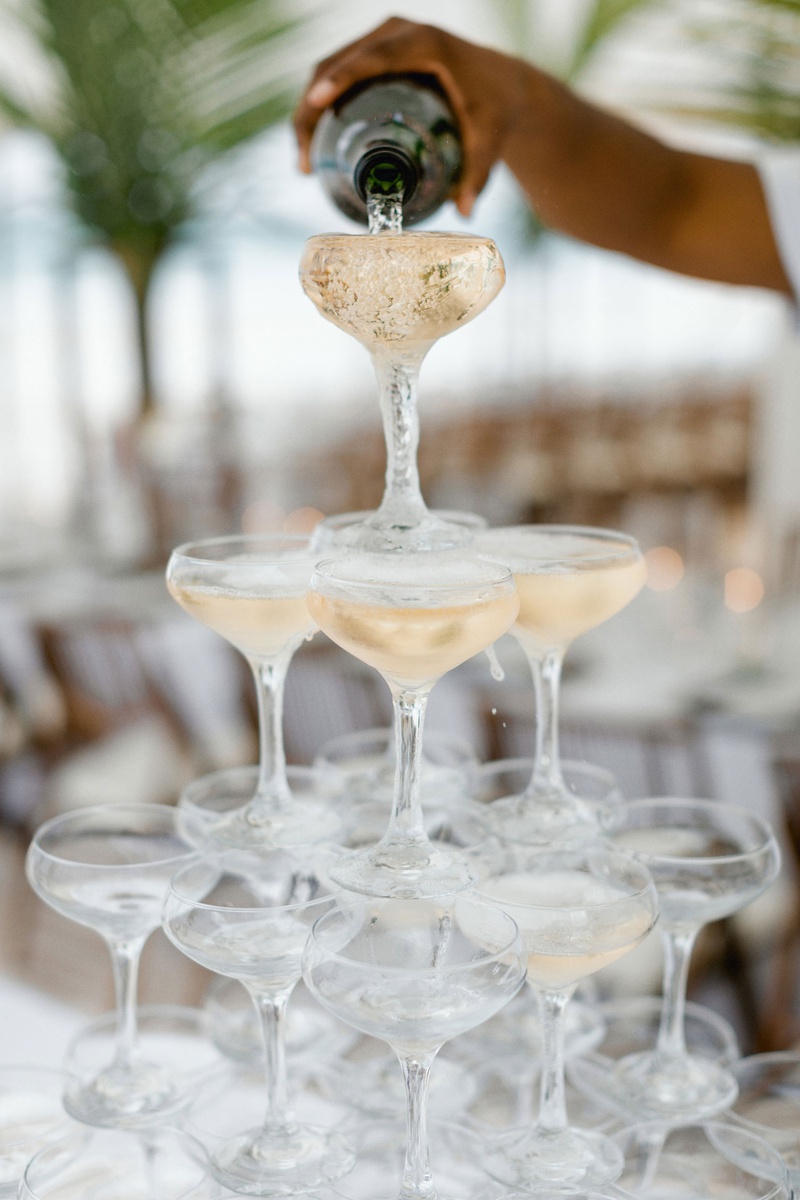 Champagne Tower at Destination Wedding
Photography: Grant Daniels Photography
Read More:
http://www.insideweddings.com/weddings/destination-wedding-with-tent-reception-on-the-beach-in-the-bahamas/1303/ destination wedding in the bahamas champagne coupe glass tower being poured