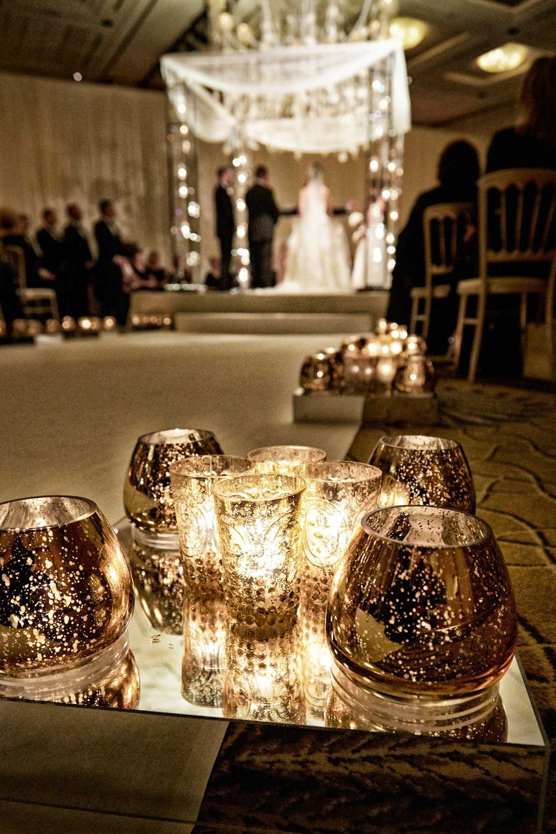 Small Votives at Interfaith Wedding Ceremony
Photography: KingenSmith
Read More:
http://www.insideweddings.com/weddings/delicately-detailed-chicago-wedding-with-jewish-christian-customs/762/ small candle votives on mirrors stand at jewish and christian interfaith ceremony