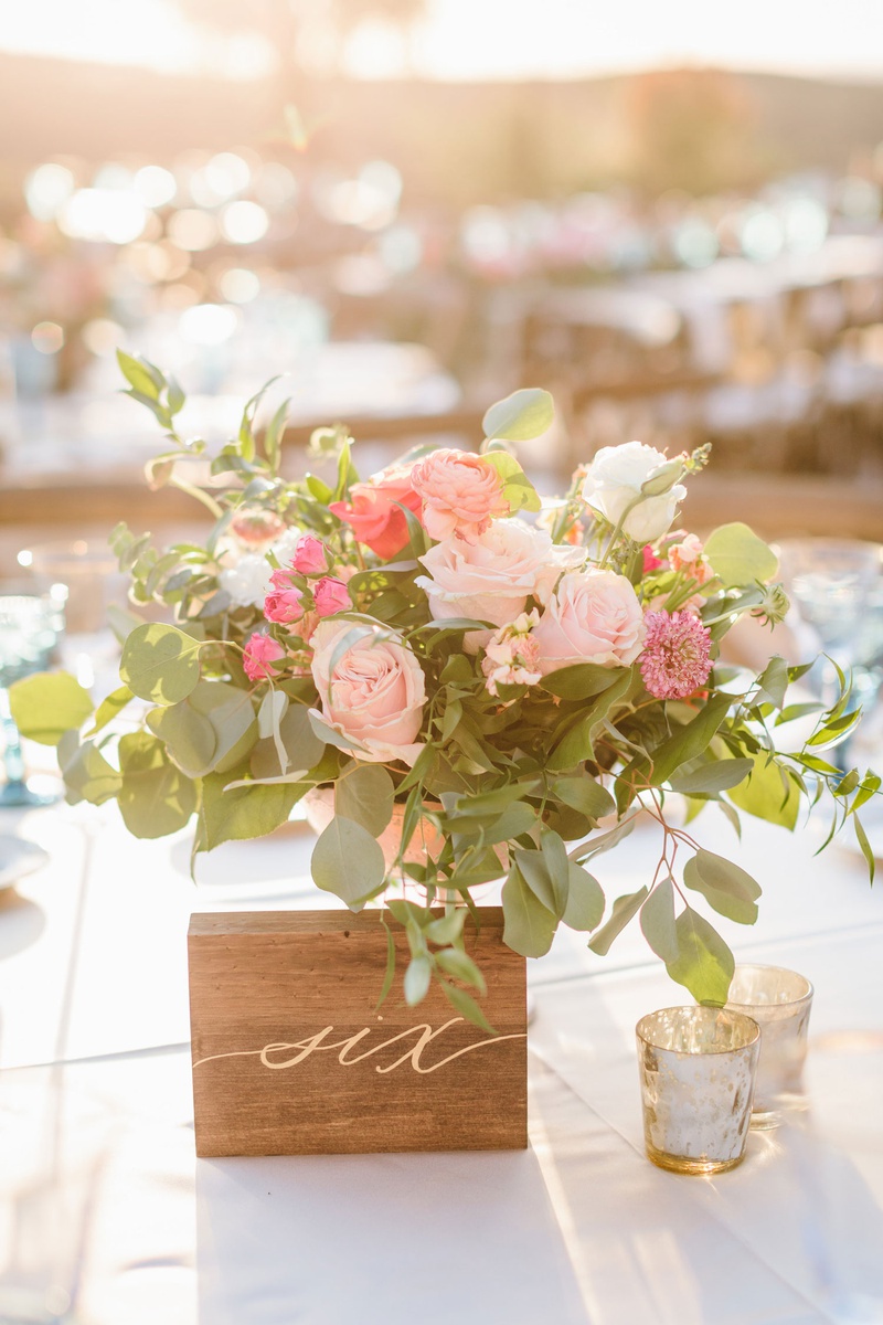 Wood Table Number with Gold Calligraphy
Photography: Jodee Debes Photography
Read More:
http://www.insideweddings.com/weddings/outdoor-ceremony-reception-with-bright-color-palette-at-la-ranch/1280/ outdoor wedding reception table number wood block with gold calligraphy number next to pink flowers