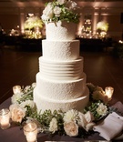 Beautiful Gluten-Free Wedding Cake
Photography: KingenSmith
Read More:
http://www.insideweddings.com/weddings/opulent-wedding-with-organic-textures-elegant-decor-in-chicago/1010/ Wedding cake with design of bride's dress and fresh flowers at top and base gluten free