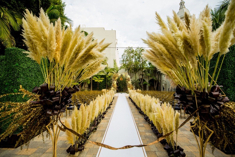 Pampas Grass at Aisle Entrance
Photography: Laura Grier of Beautiful Day Photography
Read More:
http://www.insideweddings.com/weddings/glamorous-art-deco-inspired-wedding-in-downtown-los-angeles/1162/ outdoor wedding at vibiana, pampas grass at start of aisle
