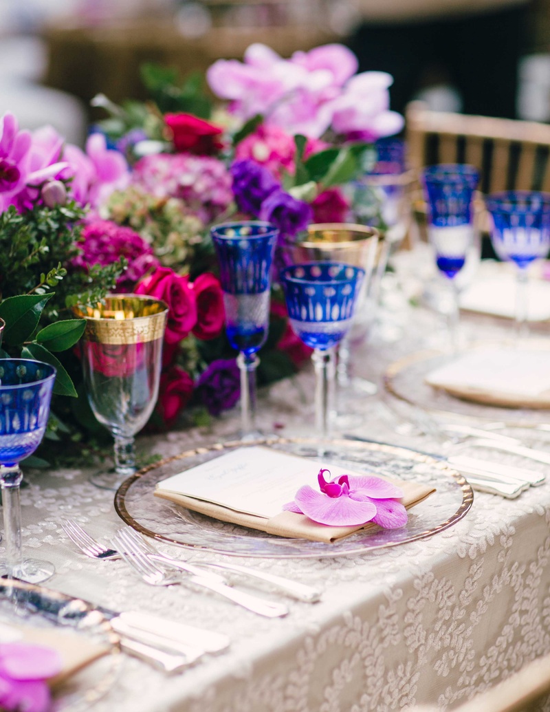 Pink Orchid at Vibrant Place Setting
Photography: Mi Belle Photographers
Read More:
http://www.insideweddings.com/weddings/colorful-outdoor-wedding-with-supper-club-theme-in-los-angeles-ca/741/ Outdoor wedding with colorful low flower centerpieces, clear gold rim charger with orchid bloom