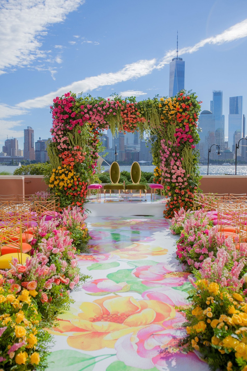 Colorful Indian-Japanese Ceremony
Photography: Clane Gessel Photography
Read More:
http://www.insideweddings.com/weddings/colorful-city-view-wedding-featuring-indian-and-japanese-traditions/1353/ wedding ceremony new york city skyline pink yellow green flower print aisle chairs mandap