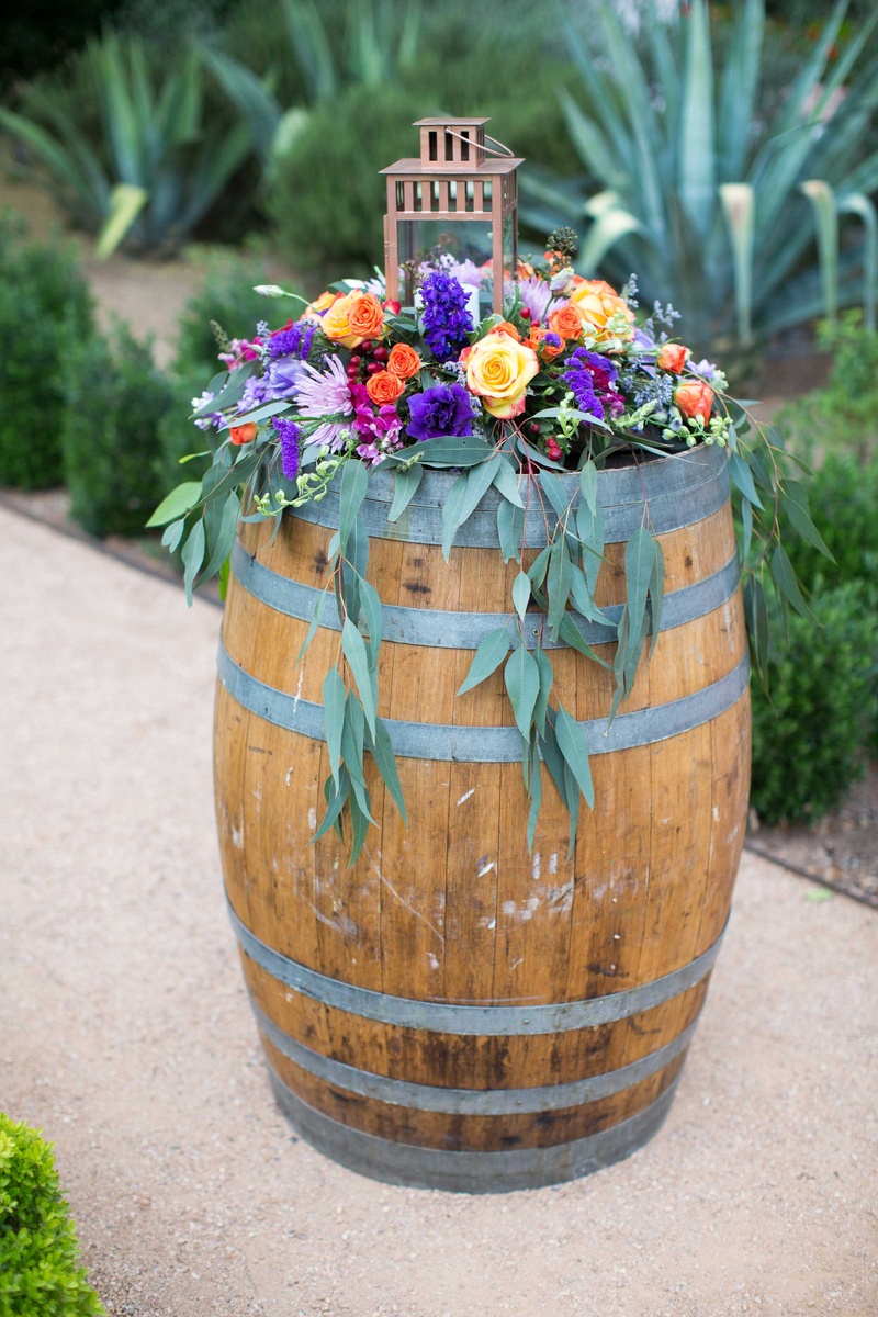 Reception Décor Photos A Colorful Floral Arrangement Atop a Wine