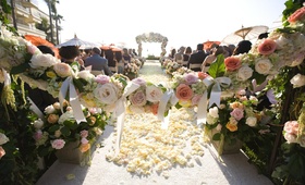Outdoor Summer Ceremony
Photography: Joe Buissink Photography
Read More:
http://www.insideweddings.com/weddings/vintage-seaside-wedding-at-the-ritz-carlton-in-california/320/ Garland of roses and bows in front of ceremony aisle