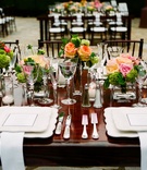 Summer Wedding Reception
Photography: Docuvitae
Read More:
http://www.insideweddings.com/weddings/canadian-american-wedding-in-malibu-california/393/ Wood table with bright flowers and scalloped chargers